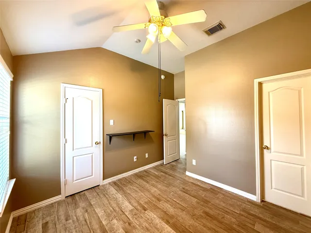 a view of a livingroom with wooden floor