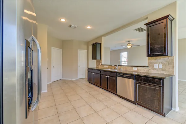 a large bathroom with a granite countertop double vanity sink a mirror and a shower