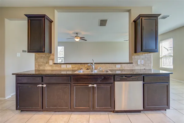 a sink with granite countertop