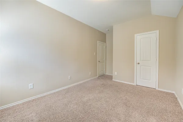 a view of an empty room and entryway