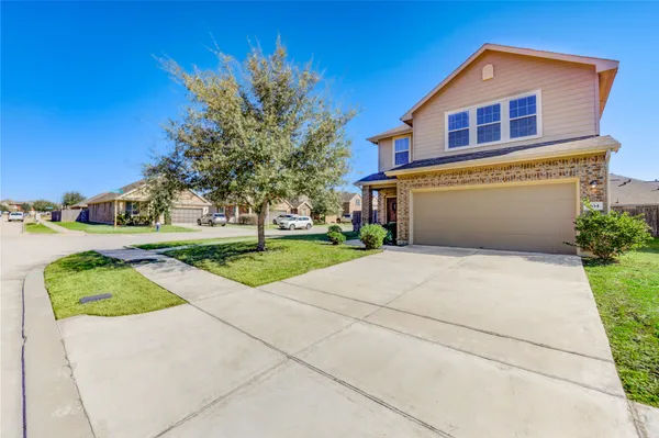 a front view of a house with yard
