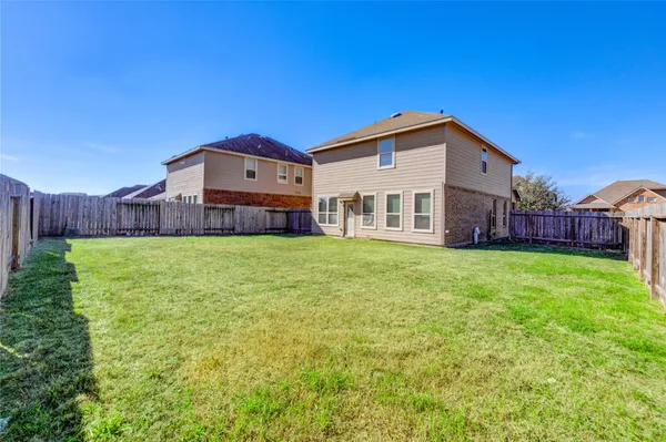 a front view of house with yard and seating area
