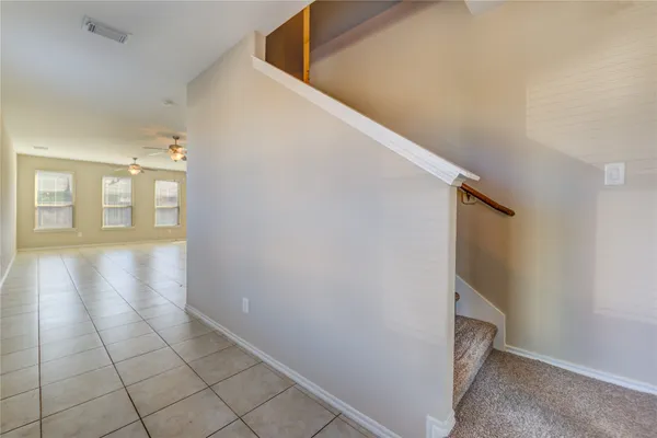 a view of an entryway with wooden floor
