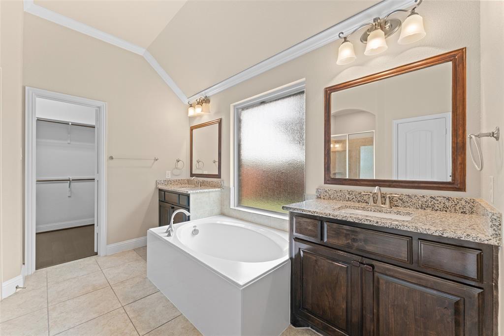 600 Fishback Circle Plano, TX 75074 - Photo 15 of 38 a bathroom with a sink and a mirror