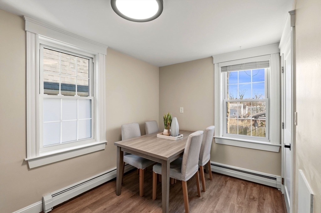 99 Mason Street, Unit 2 Salem, MA 01970 - Photo 9 of 25 a dining room with furniture and wooden floor