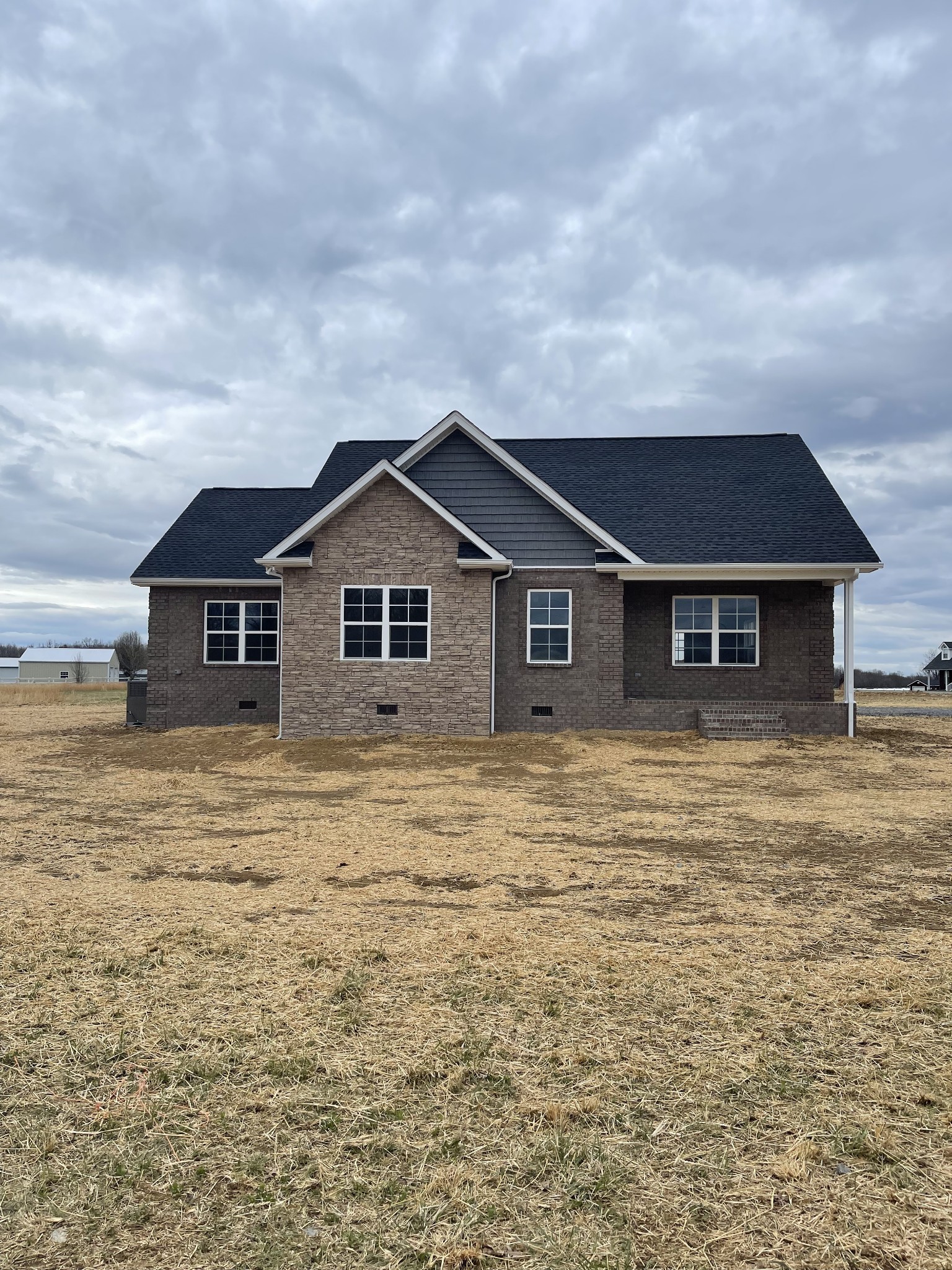 2569 Coleytown Road Lafayette, TN 37083 - Photo 1 of 20 a front view of a house with a garden
