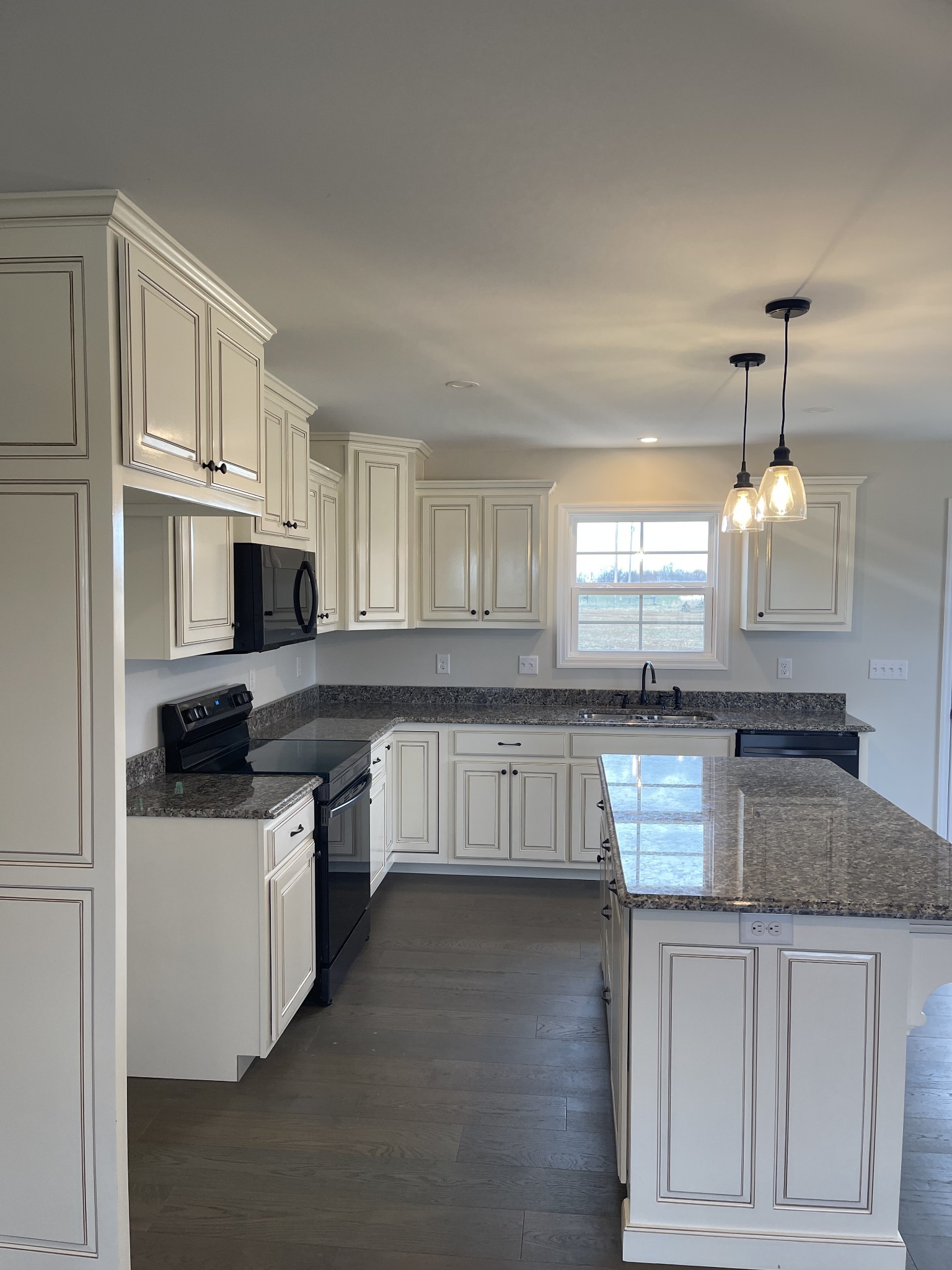 2569 Coleytown Road Lafayette, TN 37083 - Photo 6 of 20 a kitchen with stainless steel appliances granite countertop a stove a sink and a refrigerator