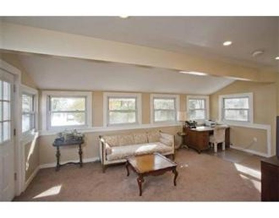 85 Pequot Point Road Westfield, MA 01085 - Photo 4 of 7 a living room with furniture two window and a table