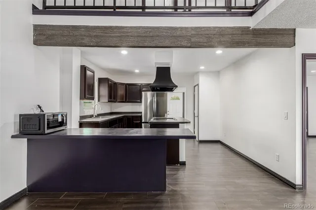 a kitchen with a sink cabinets and stainless steel appliances