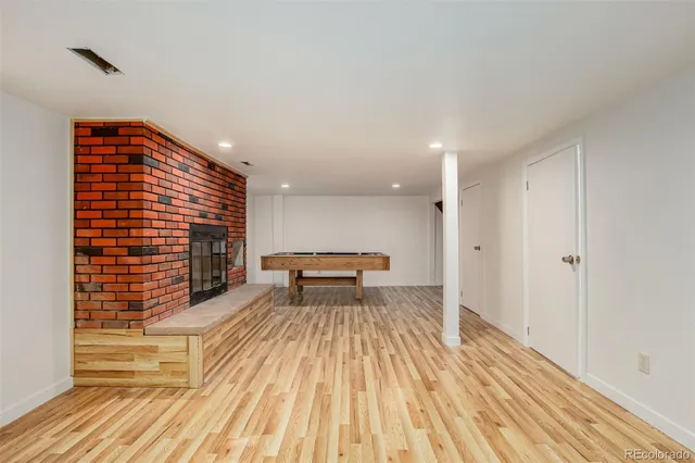 a view of kitchen with a sink and wooden floor