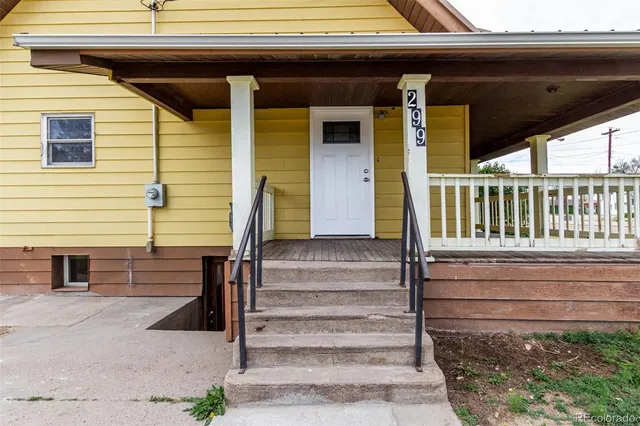 a view of house with wooden stairs