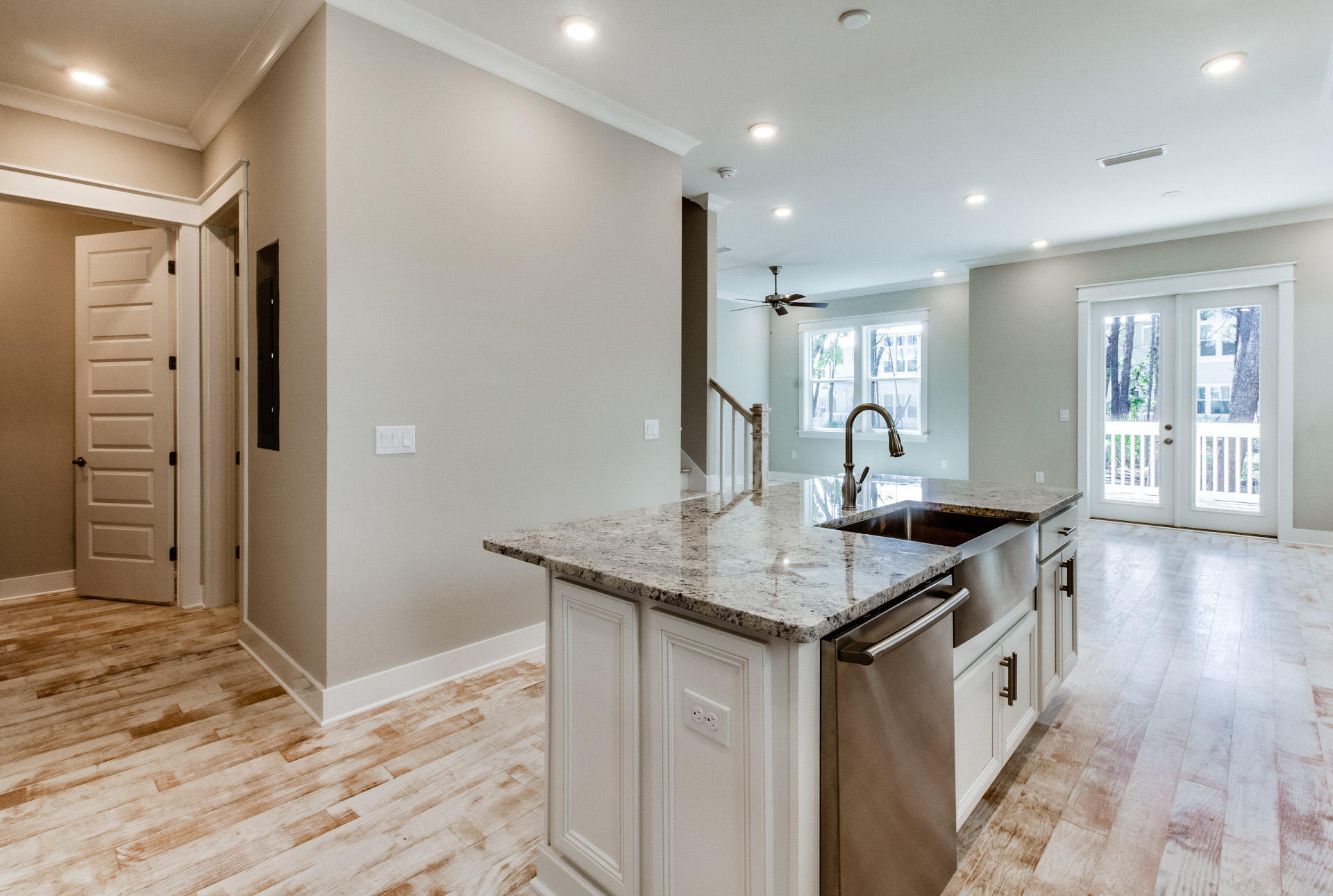 141 Pine Lands Loop Inlet Beach, Unit 519 Inlet Beach, FL 32461 - Photo 5 of 21 a kitchen with stainless steel appliances granite countertop a kitchen island a stove a refrigerator and a sink with wooden floor