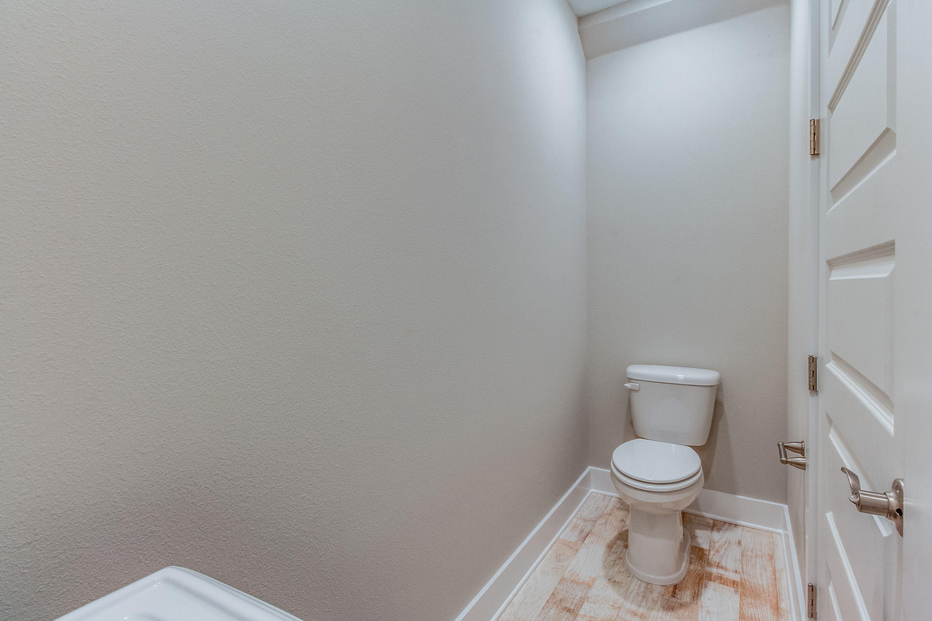 141 Pine Lands Loop Inlet Beach, Unit 519 Inlet Beach, FL 32461 - Photo 7 of 21 a white toilet sitting next to a white wall