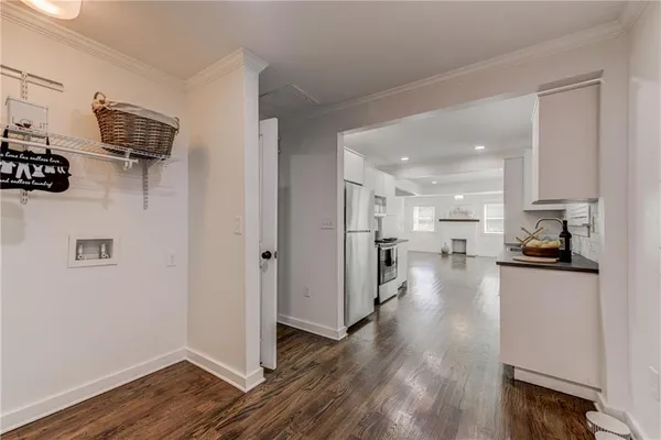 a view of a kitchen cabinets and wooden floor