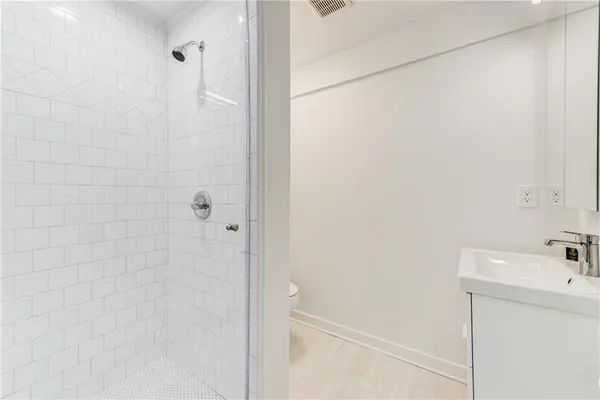 a bathroom with a sink and a shower