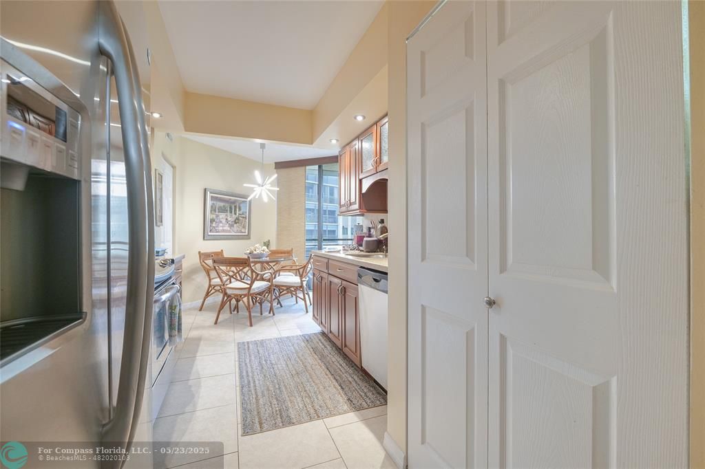 7300 Radice Court, Unit 302 Lauderhill, FL 33319 - Photo 20 of 81 a kitchen with a table and chairs in it