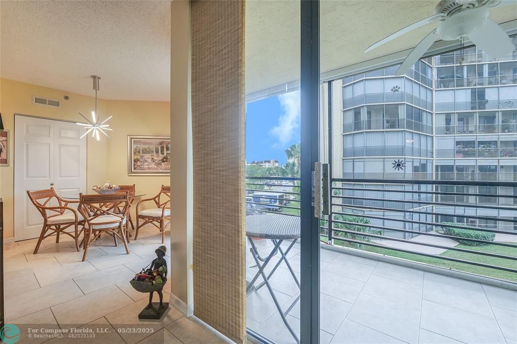 7300 Radice Court, Unit 302 Lauderhill, FL 33319 - Photo 21 of 81 a view of a balcony with table and chairs