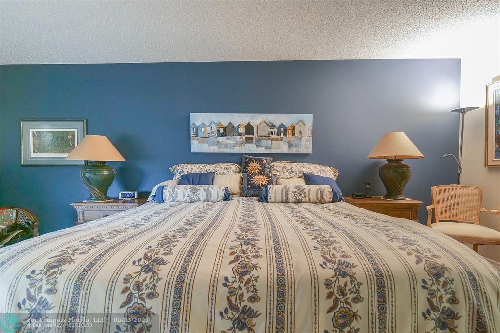 7300 Radice Court, Unit 302 Lauderhill, FL 33319 - Photo 23 of 81 a bedroom with double bed and a night stand