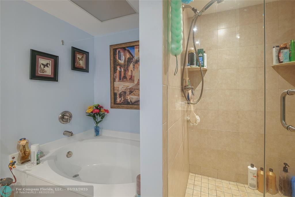 7300 Radice Court, Unit 302 Lauderhill, FL 33319 - Photo 31 of 81 a bathroom with a tub and shower
