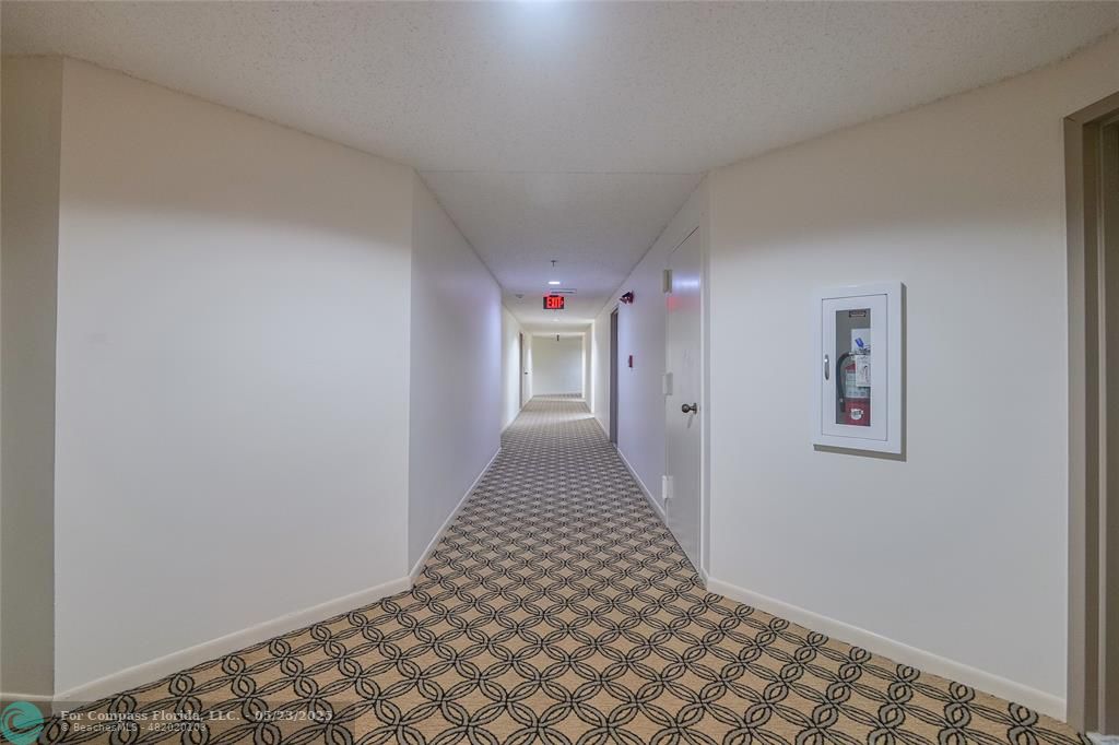 7300 Radice Court, Unit 302 Lauderhill, FL 33319 - Photo 41 of 81 a view of a hallway with closet