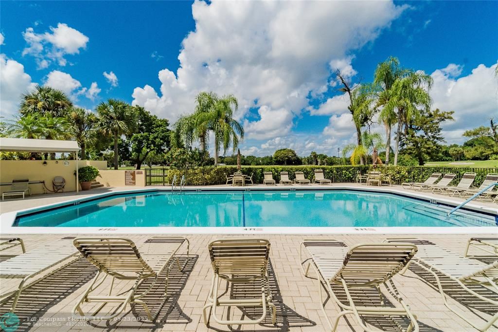 7300 Radice Court, Unit 302 Lauderhill, FL 33319 - Photo 61 of 81 a view of an outdoor space and seating area