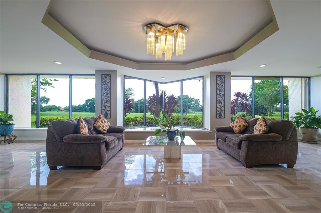 7300 Radice Court, Unit 302 Lauderhill, FL 33319 - Photo 78 of 81 a living room with furniture and a large window