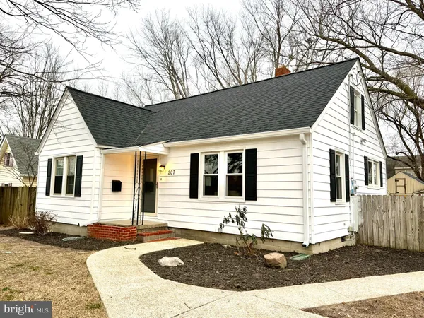 a front view of a house with yard