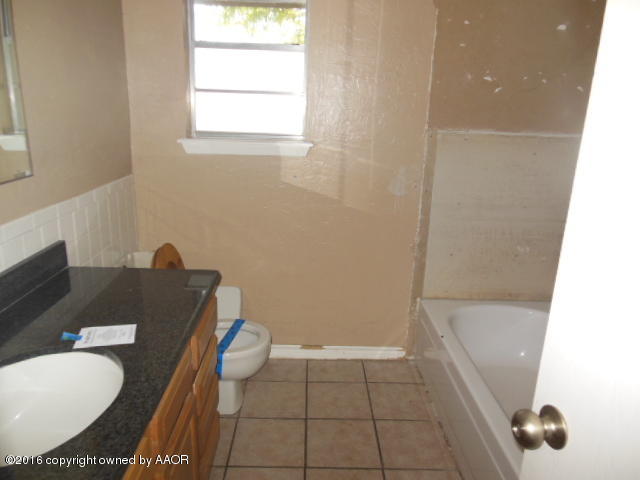 5124 Benton Drive Amarillo, TX 79110 - Photo 2 of 11 1st bathroom