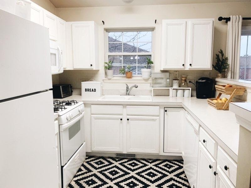2367 Chelsea Road Northbrook, IL 60062 - Photo 3 of 8 a kitchen with a sink stove and cabinets