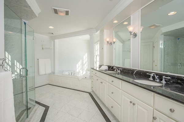 4 Lowerfield Road Weston, MA 02493 - Photo 12 of 20 a bathroom with double sink and a mirror