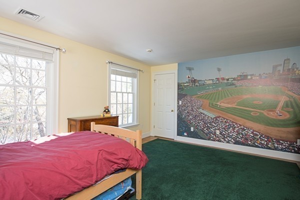 4 Lowerfield Road Weston, MA 02493 - Photo 14 of 20 a bed sitting in a bedroom next to a window