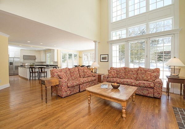4 Lowerfield Road Weston, MA 02493 - Photo 2 of 20 a living room with furniture and a large window with kitchen view