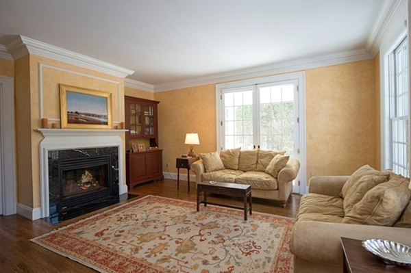4 Lowerfield Road Weston, MA 02493 - Photo 7 of 20 a living room with furniture and a fireplace