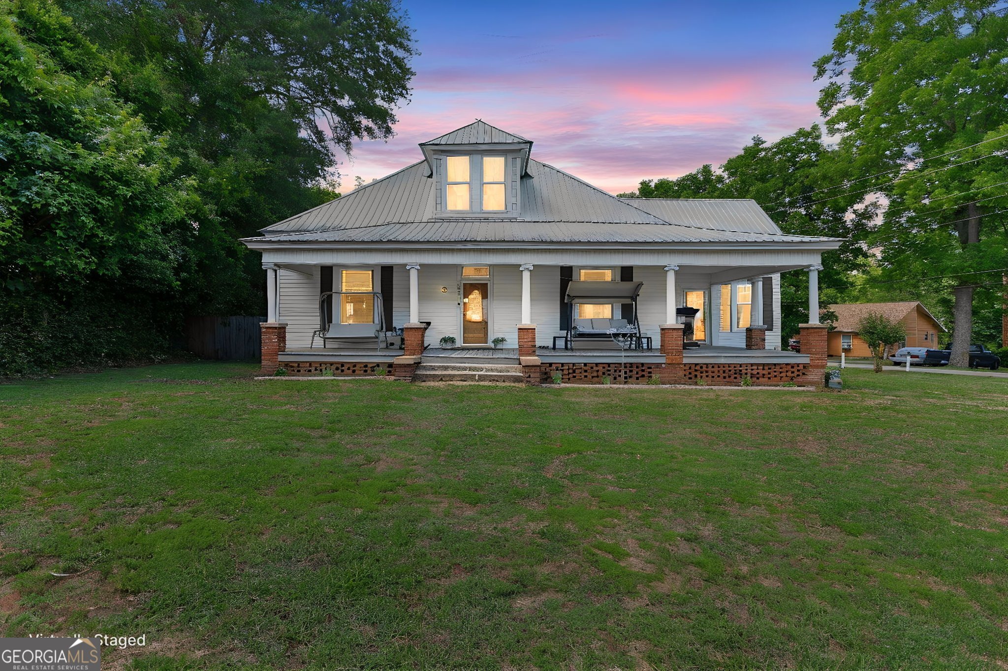 1205 Terrell Street Greenville, GA 30222 - Photo 2 of 50 a front view of a house with a yard table and chairs