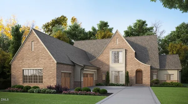 a view of a white house with a yard and potted plants