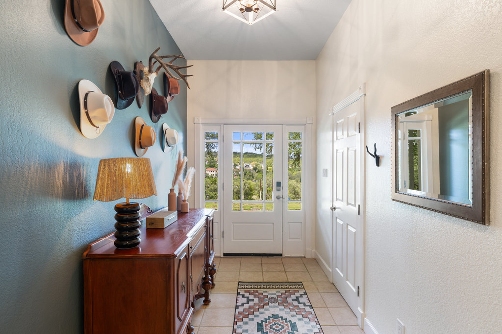 4607 R O Drive Spicewood, TX 78669 - Photo 12 of 40 a view of hallway with furniture and a window