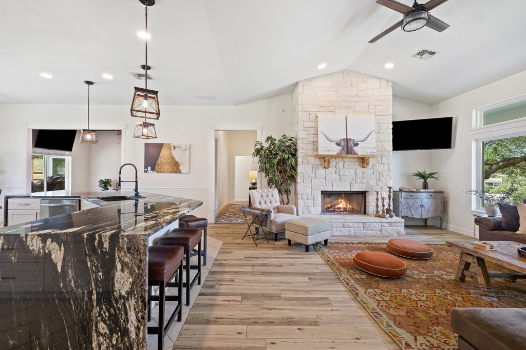 4607 R O Drive Spicewood, TX 78669 - Photo 16 of 40 a living room with fireplace furniture and a flat screen tv