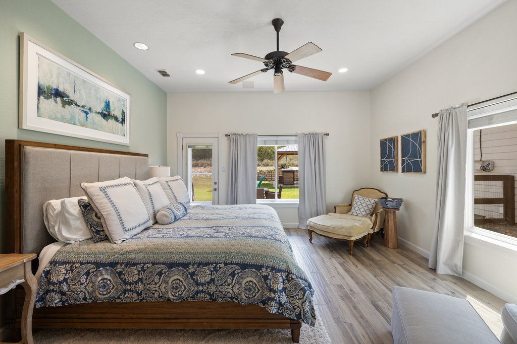 4607 R O Drive Spicewood, TX 78669 - Photo 21 of 40 a bed room with a bed couch and a window