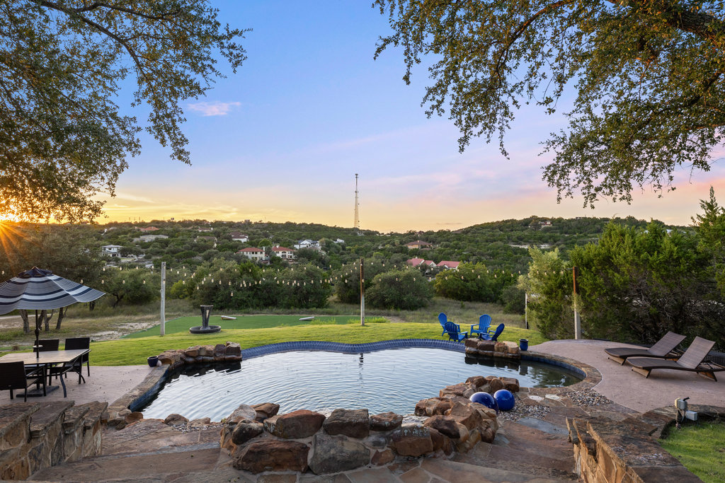 4607 R O Drive Spicewood, TX 78669 - Photo 40 of 40 a view of a swimming pool and lounge chairs