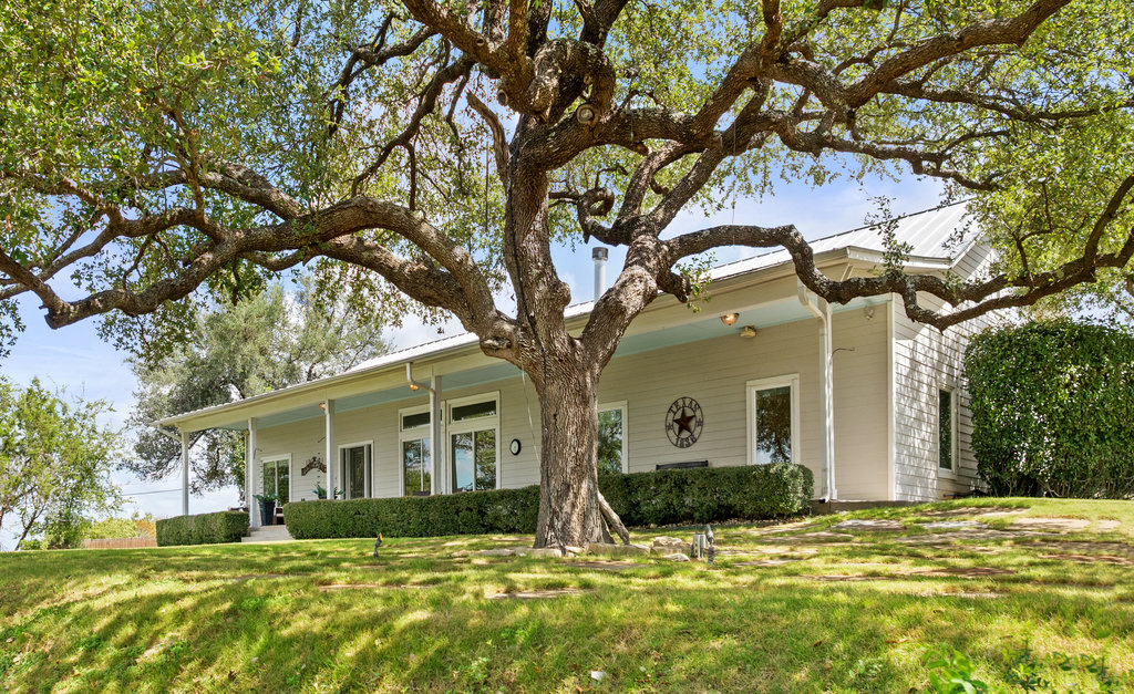 4607 R O Drive Spicewood, TX 78669 - Photo 5 of 40 a view of a yard in front of a house