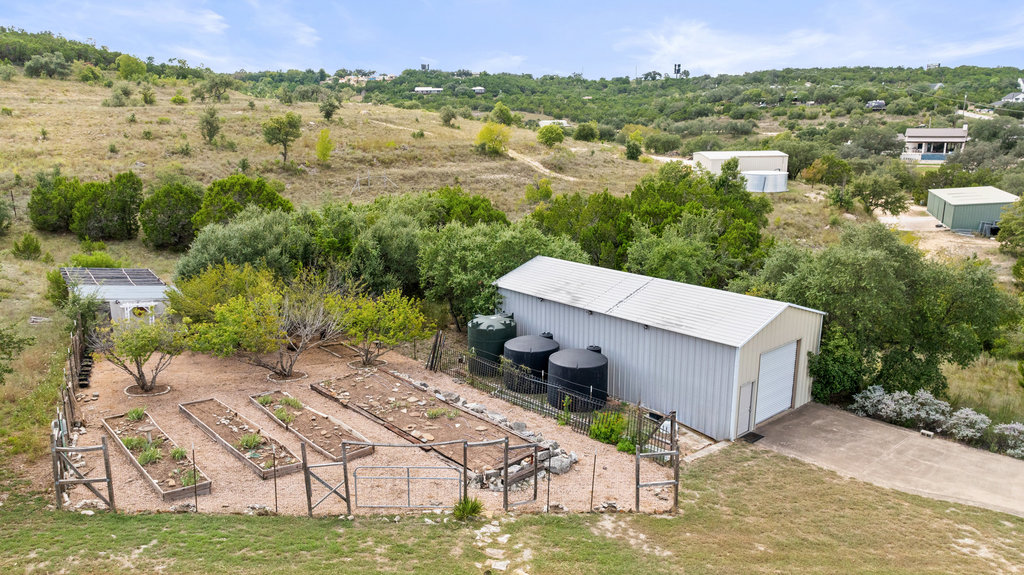 4607 R O Drive Spicewood, TX 78669 - Photo 7 of 40 a view of a terrace with a garden and trees