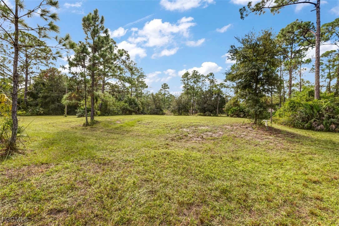 2201 Riviera Avenue Clewiston, FL 33440 - Photo 17 of 31 a view of outdoor space with deck and yard