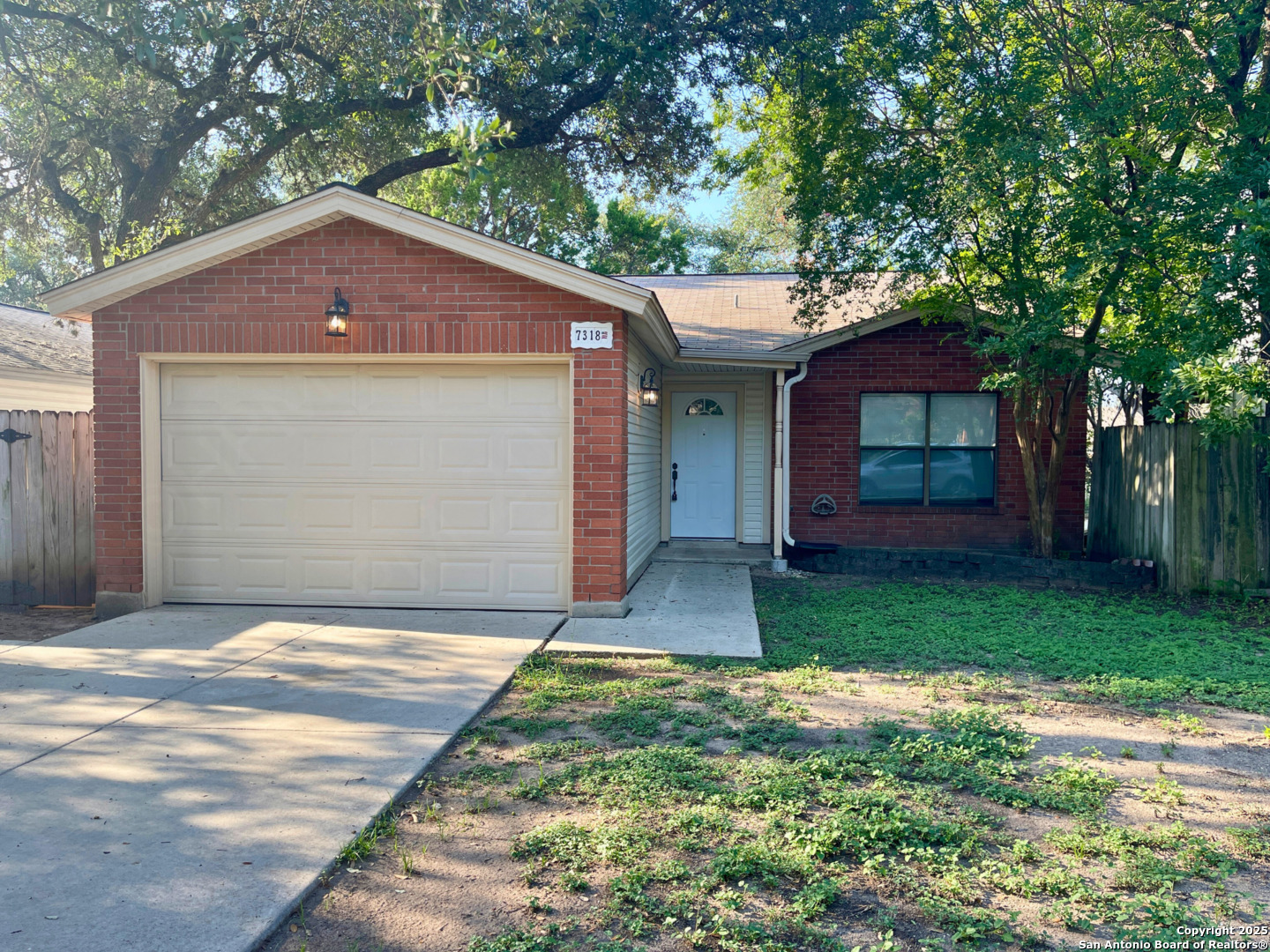 7318 Hunters Raven San Antonio, TX 78249 - Photo 2 of 18 a house with garden in front of it