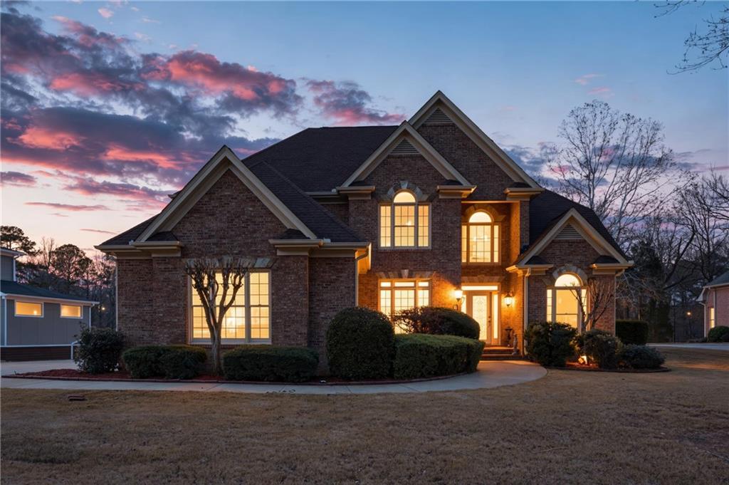 a front view of a house with a yard