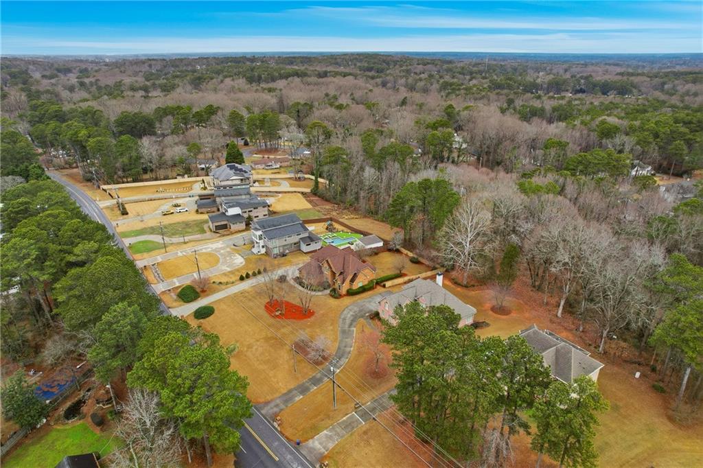 930 Old Tucker Road Stone Mountain, GA 30087 - Photo 11 of 47 an aerial view of residential houses with outdoor space