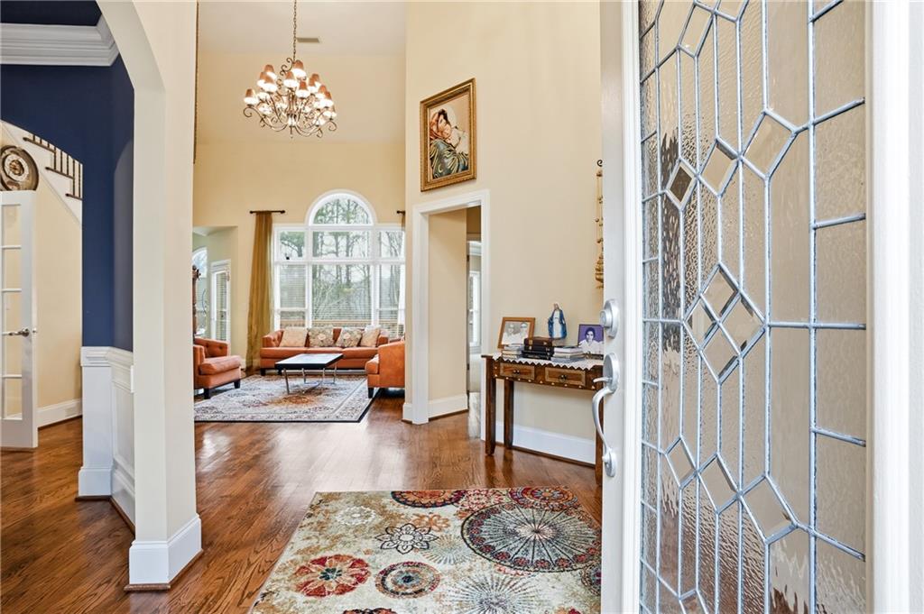 930 Old Tucker Road Stone Mountain, GA 30087 - Photo 13 of 47 a living room with furniture and wooden floor