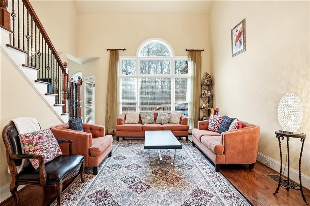 930 Old Tucker Road Stone Mountain, GA 30087 - Photo 15 of 47 a living room with furniture and a large window