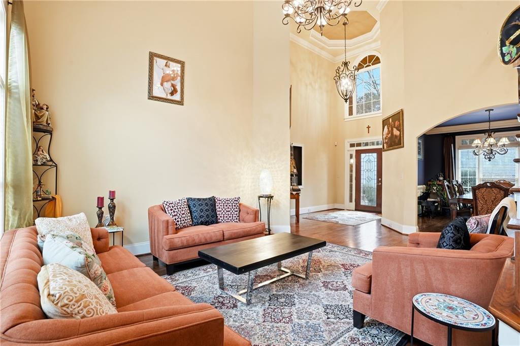 930 Old Tucker Road Stone Mountain, GA 30087 - Photo 17 of 47 a living room with furniture and a large window