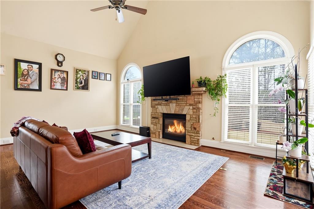 930 Old Tucker Road Stone Mountain, GA 30087 - Photo 18 of 47 a living room with furniture a window and a fireplace