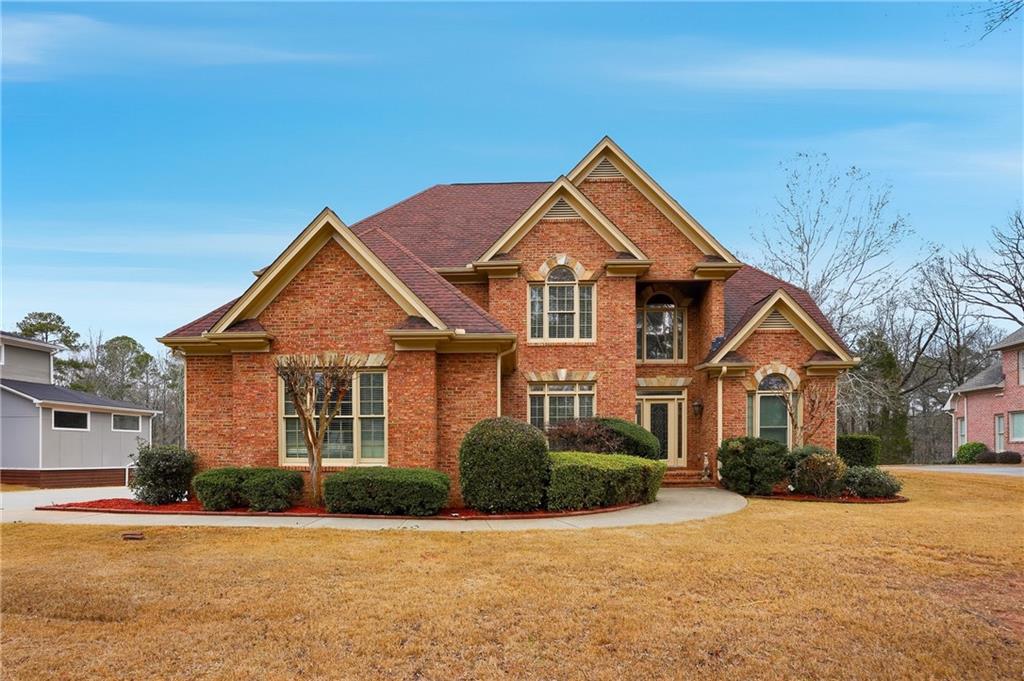 930 Old Tucker Road Stone Mountain, GA 30087 - Photo 2 of 47 front view of a house with a yard